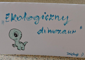 Napis "Ekologiczny dinozaur".
