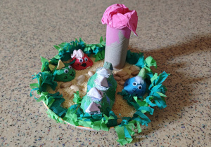 Rodzinka Eko dinozaurów na wyspie.